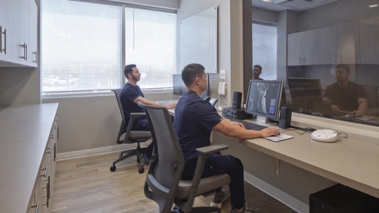 Technologists at an Amera Imaging reading station